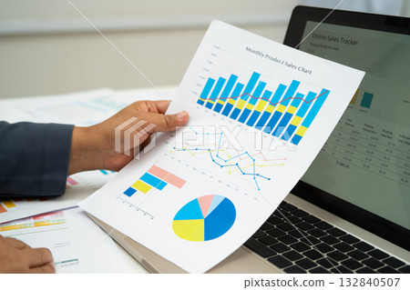 Asian business woman working with financial graph. Asian business woman working with financial graph. 132840507