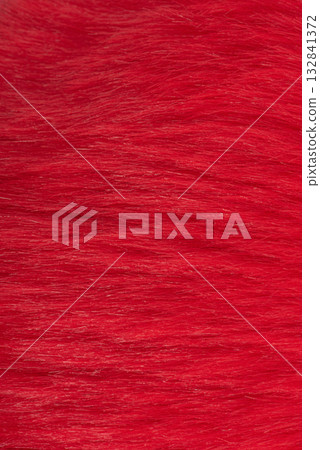 Vertical photo of red faux fur macro photo as background. 132841372