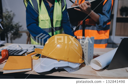 Architects and engineers working collaboratively on construction project Architects and engineers working collaboratively on construction project 132841498