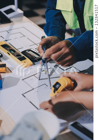 Architects and engineers working collaboratively on construction project Architects and engineers working collaboratively on construction project 132841517