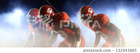 American football players in dynamic formation with misty background American football players in dynamic formation with misty background 132841665