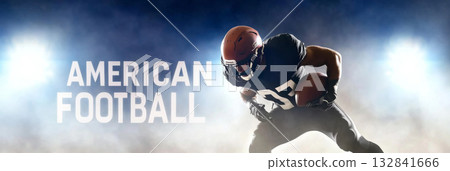American football player in red uniform in action with stadium lights with text American football 132841666