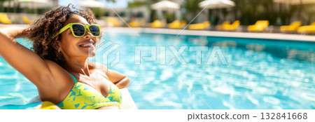 Smiling mixed race woman at poolside enjoying summer day, copy space Smiling mixed race woman at poolside enjoying summer day, copy space 132841668