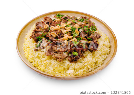 Delicious plate of rice topped with seasoned meat and nuts at a local eatery 132841865