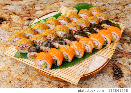 Fresh sushi platter with assorted rolls prepared for a special gathering 132841938