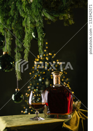 Winter celebration with holiday drink and glowing tree lights Winter celebration with holiday drink and glowing tree lights 132842071