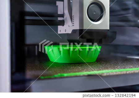 3d printer printing an object on the tray with pla filament, corn starch, non-waterproof filament 3d printer printing an object on the tray with pla filament, corn starch, non-waterproof filament 132842194