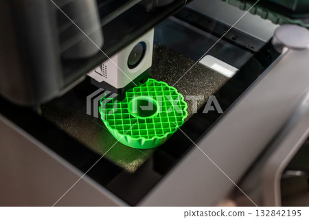 3d printer printing an object on the tray with pla filament, corn starch, non-waterproof filament 3d printer printing an object on the tray with pla filament, corn starch, non-waterproof filament 132842195