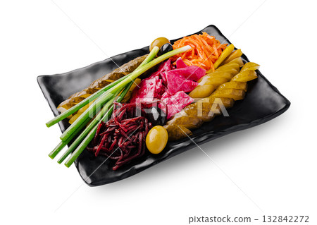 Colorful platter of assorted pickled vegetables on a black plate Colorful platter of assorted pickled vegetables on a black plate 132842272