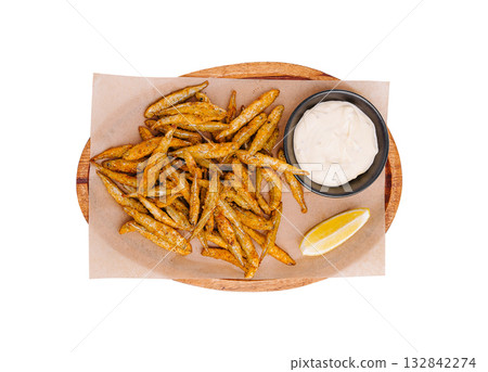 Crispy fried fish served with dipping sauce and lemon wedge Crispy fried fish served with dipping sauce and lemon wedge 132842274