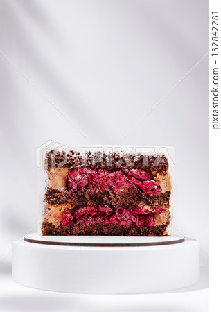 Tasty dessert with cake, cream, and fruit in a vibrant display Tasty dessert with cake, cream, and fruit in a vibrant display 132842281