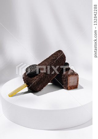 Decadent chocolate ice cream bars with cookies on display for dessert lovers Decadent chocolate ice cream bars with cookies on display for dessert lovers 132842288