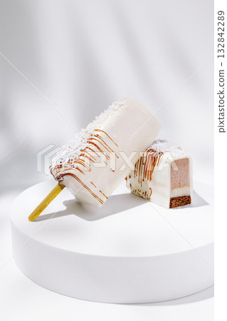 Delicious ice cream treats displayed on a simple white pedestal 132842289