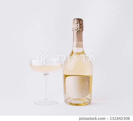 Elegant champagne bottle and glass ready for celebration or toast at event 132842306