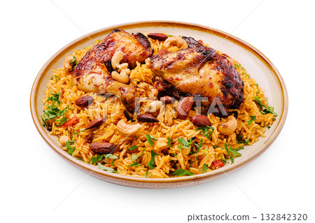 Delicious plate of spicy rice with grilled chicken and nuts on the side Delicious plate of spicy rice with grilled chicken and nuts on the side 132842320
