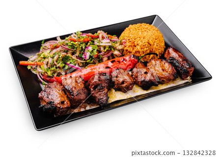 Delicious grilled meat platter served with colorful salad and rice Delicious grilled meat platter served with colorful salad and rice 132842328