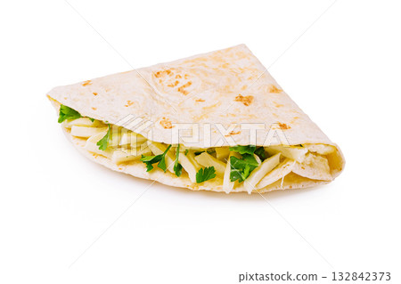 Fresh tortilla filled with cheese and cilantro served in a warm setting Fresh tortilla filled with cheese and cilantro served in a warm setting 132842373