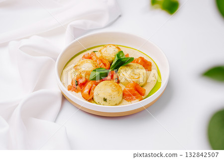 Fresh gourmet dish featuring creamy cheese and diced tomatoes with basil Fresh gourmet dish featuring creamy cheese and diced tomatoes with basil 132842507
