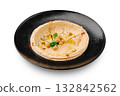 Creamy hummus served in a black plate with olive oil and spices 132842562