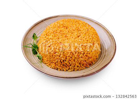 Colorful plate of seasoned rice served with herbs on a simple dish Colorful plate of seasoned rice served with herbs on a simple dish 132842563