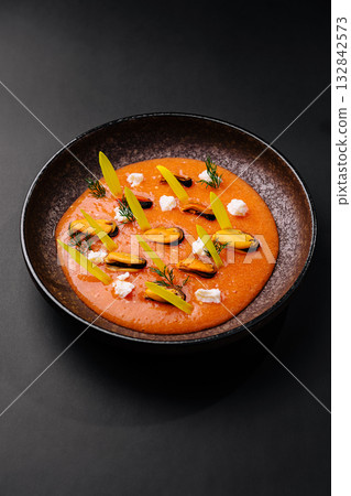 Delicious seafood dish served in a creative presentation with fresh ingredients Delicious seafood dish served in a creative presentation with fresh ingredients 132842573