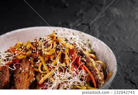 Asian stir-fry noodle dish with sesame seeds 132842743