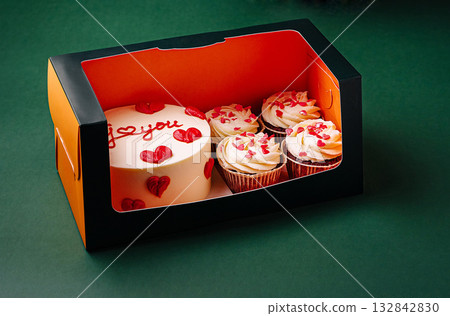Celebration cake and cupcakes with flowers arranged for special Celebration cake and cupcakes with flowers arranged for special 132842830