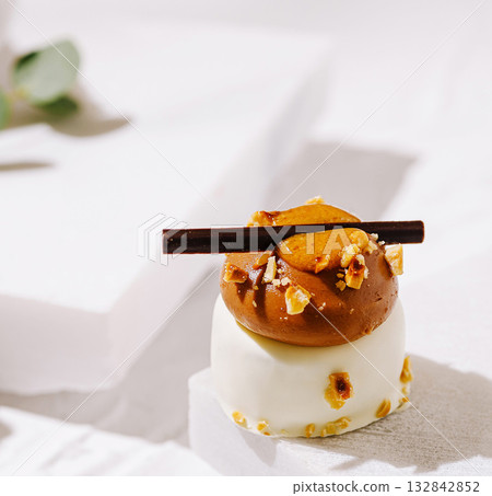 Delicious dessert with chocolate mousse and caramel topping at a stylish cafe 132842852