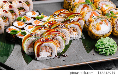 Gourmet sushi platter with sauces and garnishes Gourmet sushi platter with sauces and garnishes 132842915