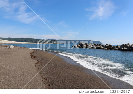 A calm coastal landscape with blue sea and sky A calm coastal landscape with blue sea and sky 132842927