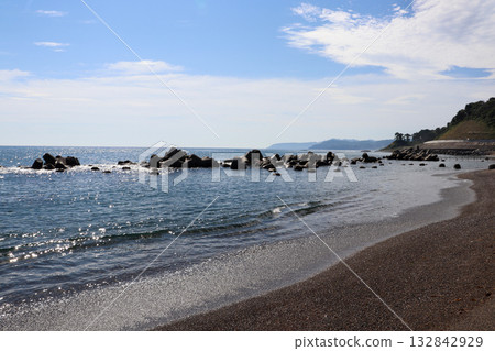 A calm coastal landscape with blue sea and sky 132842929