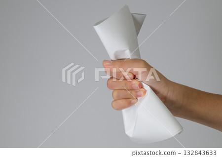 Clutched white paper and hands 132843633