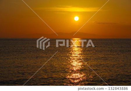 View of the sunset over Shodoshima from Keino Matsubara Beach in Minamiawaji City, Hyogo Prefecture 132843886