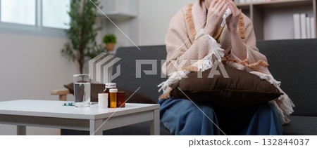 Health Awareness: Young woman feeling unwell with cold symptoms 132844037