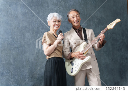 Senior men and women forming a rock band Senior men and women forming a rock band 132844143