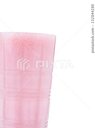 Refreshing pink drink served in a transparent cup at a summertime gathering Refreshing pink drink served in a transparent cup at a summertime gathering 132844280