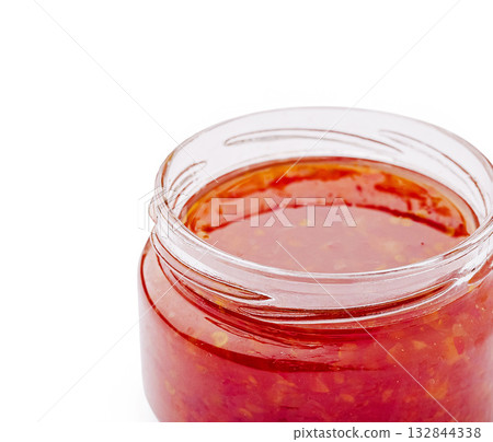 Homemade spicy chili sauce in a jar ready for culinary adventures 132844338
