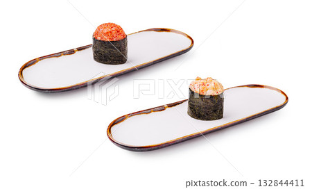 Delicious sushi rolls served on elegant plates in a minimalist setting Delicious sushi rolls served on elegant plates in a minimalist setting 132844411