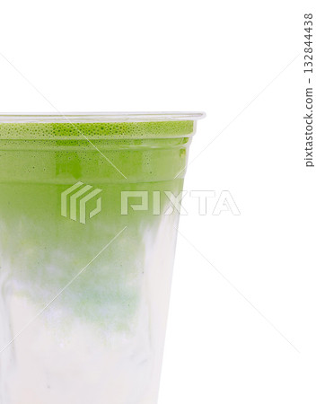 Refreshing green beverage in clear cup on a bright background Refreshing green beverage in clear cup on a bright background 132844438