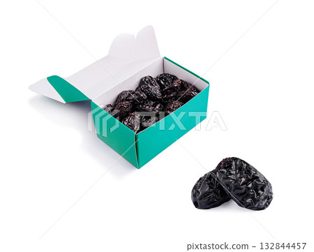 Enjoy dried plums in a colorful box for healthy snacking options Enjoy dried plums in a colorful box for healthy snacking options 132844457