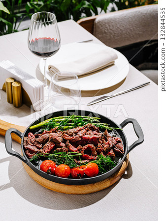 Delicious grilled steak with vegetables served in a fine dining setting 132844535