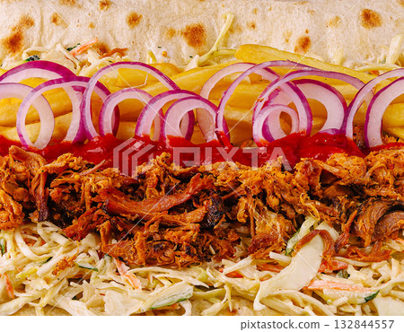 Delicious street food wrap with pulled meat and fresh toppings 132844557