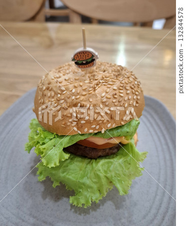 Vegan burger with lettuce and sesame bun 132844578