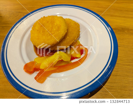 Malakoff (fried cheese) with paprika, a Swiss specialty from the canton of Vaud Malakoff (fried cheese) with paprika, a Swiss specialty from the canton of Vaud 132844713