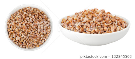 Boiled buckwheat in a ceramic bowl isolated on white background. Top view. Flat lay 132845503