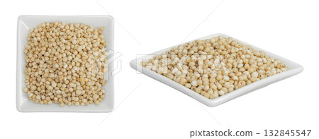Sorghum seeds in ceramic bowl isolated on white background. Top view. Flat lay. Sorghum seeds in ceramic bowl isolated on white background. Top view. Flat lay. 132845547
