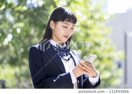 High school girl with a smartphone 132845666