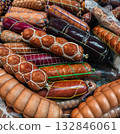 Variety of sausages arranged for sale at a local market in vibrant colors during the afternoon 132846061
