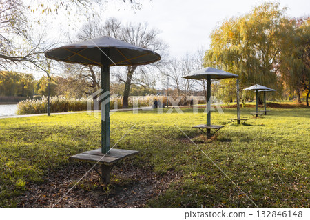 Old iron umbrella awnings in the park near the beach. 132846148