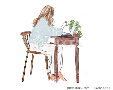 A woman working on a PC at a desk 132846655